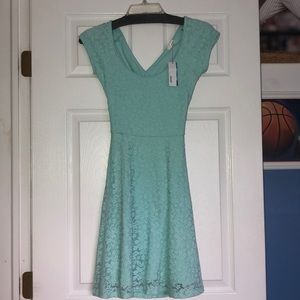 NEVER WORN Garage lace dress with a crossed back